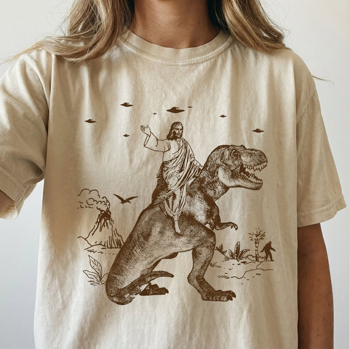Jesus Riding Dinosaur Graphic T-Shirt - Funny UFO Novelty product image 1